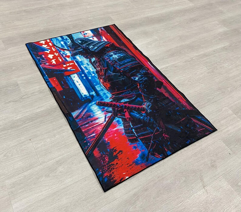 May include: A colorful rug with a samurai warrior in black armor standing in a red and blue cityscape. The warrior is holding a sword and is looking to the left.