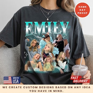 May include: Dark gray t-shirt featuring the name "EMILY" in a teal and white design, with a collage of images. The shirt includes text that reads "MADE IN USA" and "WE CREATE CUSTOM DESIGNS BASED ON ANY IDEA YOU HAVE IN MIND."