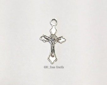 May include: Silver-toned metal crucifix charm with a detailed figure of Jesus Christ. The charm is 4301_Cross Crucifix.