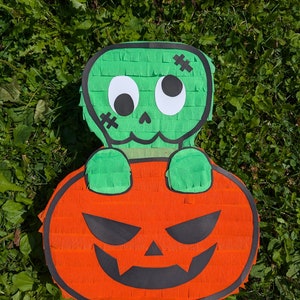 Halloween piñata. Beautiful zombie and pumpkin piñata for kids. Pinata game