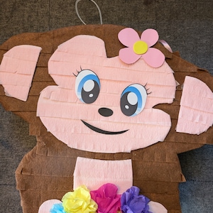 Beautiful monkey flowers piñata for kids party. Pinata party. Piñata game