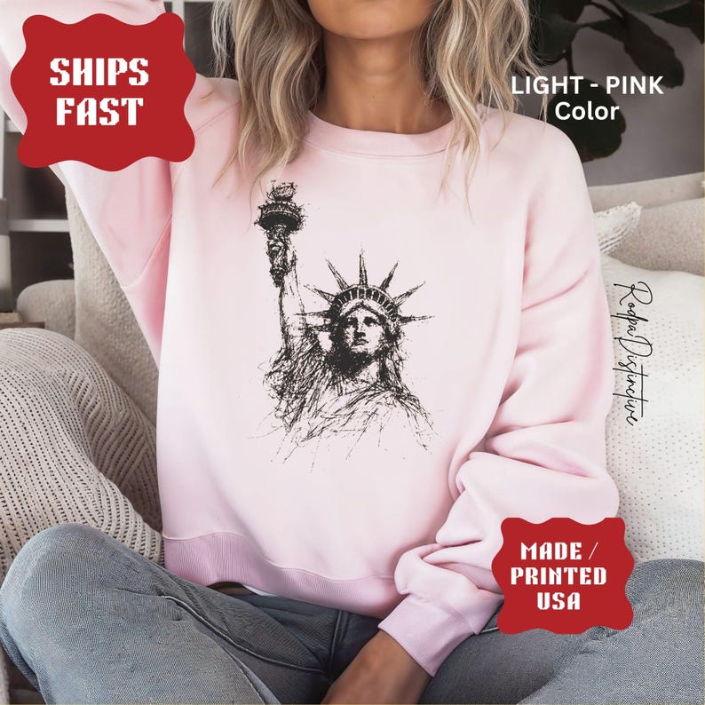 Statue of Liberty graphic t-shirt featuring a patriotic vintage-style New York design, perfect for American pride and freedom lovers.