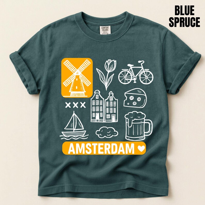 Blue Spruce  t-shirt with white graphic icons of a windmill, tulips, bicycle, houses, cheese, beer, and a sailboat. The word "AMSTERDAM" is in orange.