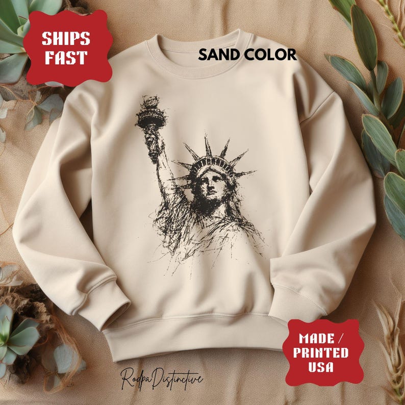 Statue of Liberty graphic t-shirt featuring a patriotic vintage-style New York design, perfect for American pride and freedom lovers.