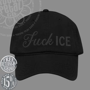 May include: A black baseball cap featuring the text "Fuck ICE" embroidered in a dark, tonal thread across the front panels. The cap has a structured crown, a curved brim, and a button at the top, showcasing a monochromatic design throughout.