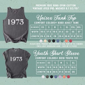 May include: A dark gray tank top and a matching short sleeve t-shirt, both featuring the white text 1973. The image includes two sizing charts for the Comfort Colors 9360 adult tank top and 9018 youth tee, listing widths and lengths in inches.