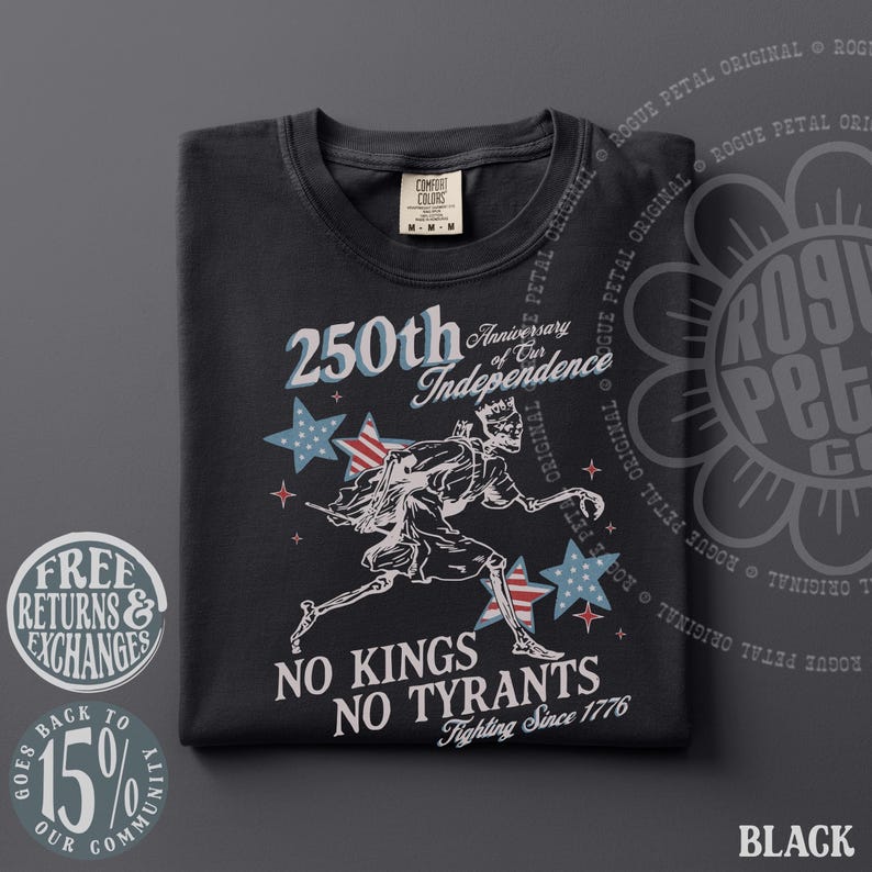 May include: Black t-shirt with a graphic celebrating the 250th anniversary of independence. The design includes stars, a running figure, and the text "No Kings No Tyrants Fighting Since 1776."