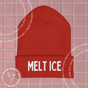 May include: A solid red beanie with the white text "MELT ICE" across the front. The beanie is a warm, winter hat. The background is a pink tile pattern.