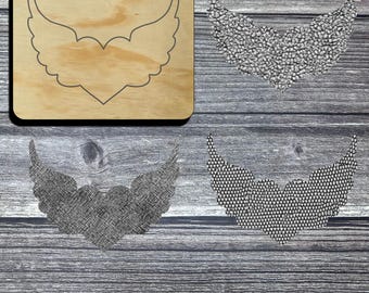 May include: A wooden die cut with a wing and heart design, with the number 019 printed in the upper left corner. Three examples of the die cut are shown in different materials, including a textured gray fabric and a dotted pattern.