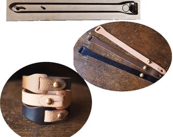 May include: Three leather bracelets with brass accents. The bracelets are stacked on top of each other. The bracelets are brown, black, and tan.
