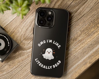 Puede incluir: Carcasa de teléfono negra con un gráfico de fantasma blanco y el texto "OMG I'M LIKE, LITERALLY DEAD".