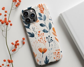 Könnte beinhalten: Eine weiße Handyhülle mit einem Blumenmuster mit orangefarbenen, blauen und weißen Blumen und Blättern. Die Hülle hat einen Ausschnitt für die Kamera des Handys.