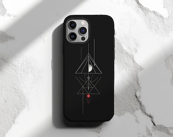 Puede incluir: Carcasa de teléfono negra con un diseño geométrico que presenta un triángulo blanco, un círculo y líneas. La carcasa tiene un punto rojo en el centro del diseño.