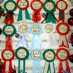 May include: A collection of festive Christmas ribbon badges with various holiday-themed phrases like "Holly Jolly," "Santa Claus," and "Merry Christmas." Each badge has a circular design with a decorative ribbon.