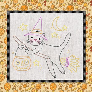 May include: An embroidery pattern on light fabric featuring a cat wearing a purple witch hat with a spider, riding a broomstick while holding a jack-o'-lantern bucket. The design includes yellow stars and a crescent moon, outlined in black thread.