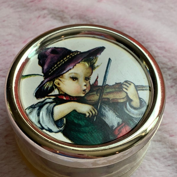vintage Swiss music box, plays Edelweiss, changeable Hummel picture, plastic round case, gift for her