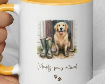 May include: White ceramic mug with a yellow rim. The mug features a watercolor illustration of a golden retriever dog sitting by a door with muddy paw prints and the text "Muddy paws allowed".