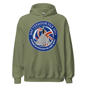 May include: An olive green hooded sweatshirt featuring a circular graphic with a fighter jet and the text "RAF TYPHOON FGR MK4 4TH GENERATION FIGHTER & MULTI-ROLE COMBAT AIRCRAFT". The graphic includes the Union Jack flag.