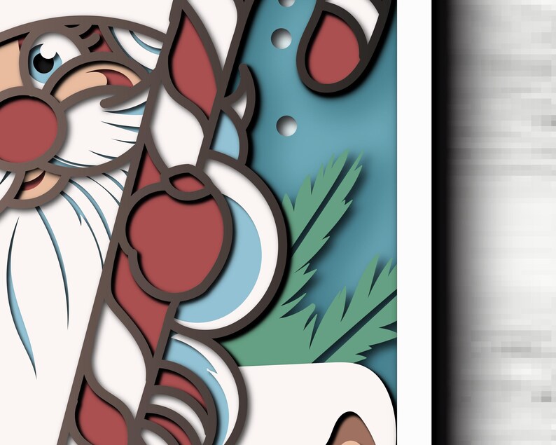 May include: A layered paper art piece featuring a stylized Santa Claus with a white beard and red hat, holding a red and white striped candy cane. The design includes green pine needles and circular accents against a blue background.
