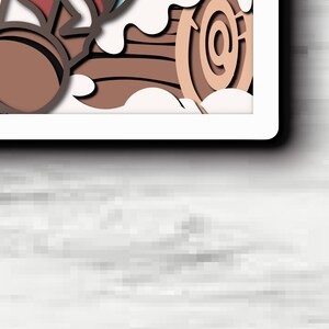 May include: A multi-layered paper art piece featuring a stylized brown log with circular grain patterns, accented by white cloud-like shapes and a dark red element, all framed within a white border against a light gray textured background.