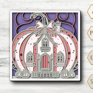 May include: A layered paper art piece featuring a pumpkin-shaped house with a bow, chimney, and windows. The design incorporates shades of pink, white, and purple, with a white border. The image includes file type icons: AI, PDF, DXF, and SVG.