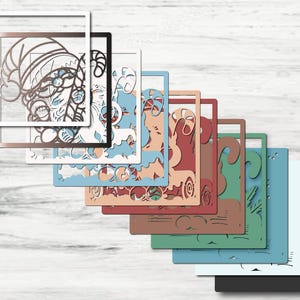 May include: A layered square craft design featuring a Santa Claus figure with a candy cane, presented in a series of overlapping frames in various colors including white, metallic bronze, light blue, peach, red, green, and solid black.