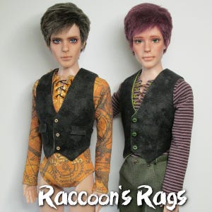 May include: Two dolls wearing black vests with green and gold accents. The doll on the left is wearing a long-sleeved shirt with a map pattern. The doll on the right is wearing a striped long-sleeved shirt. The text "Raccoon's Rags" is at the bottom of the image.