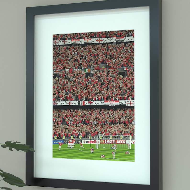 May include: A framed photograph of a football match with a crowd of fans cheering in the background. The players are in the foreground, celebrating a goal. The image includes the text "AMSTEL BEER" and "NUTELLA".