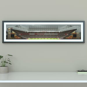 May include: A panoramic photograph of a packed football stadium with a gray and white roof. The stadium is filled with fans wearing red and white jerseys.