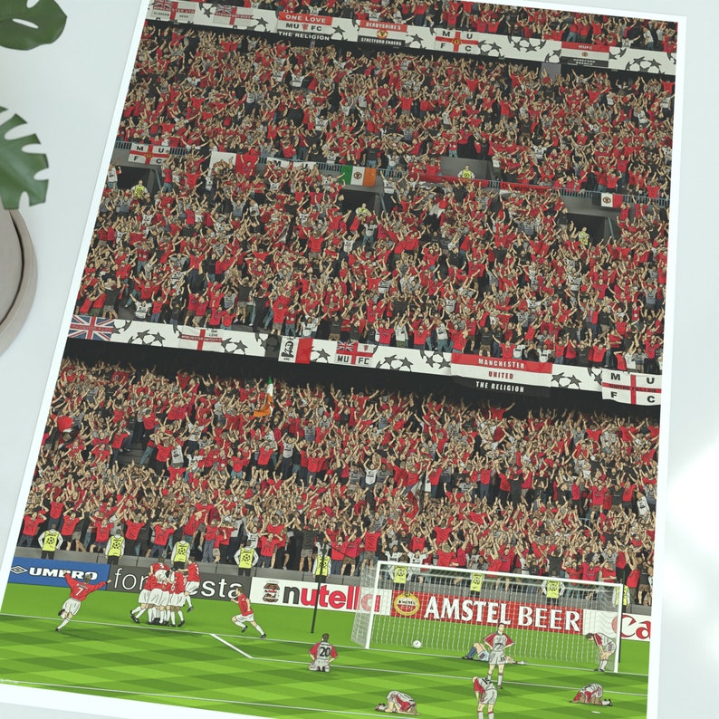 May include: A digital illustration of a football match with a crowd of supporters cheering in the background. The players are wearing red and white kits and the pitch is green. The words "Nutella" and "Amstel Beer" are visible on the side of the pitch.