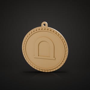 May include: A circular tan pendant featuring a raised archway symbol in the center and a decorative beaded border along the outer edge. The pendant includes a small loop at the top for attachment, presented in a solid, monochromatic tan color.