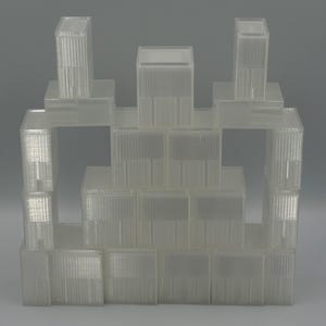 May include: A collection of translucent, rectangular plastic storage containers stacked in a pyramid formation. Each container features a clear, ribbed exterior surface with a smooth, flat lid, creating a uniform and modular storage system.