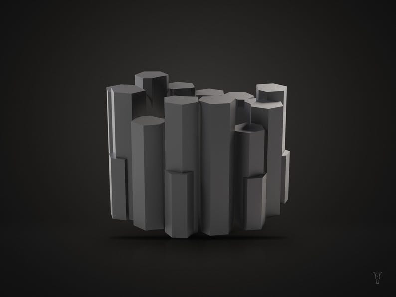 Puede incluir: Un objeto escult&oacute;rico de color gris oscuro compuesto por m&uacute;ltiples columnas hexagonales verticales de alturas variables dispuestas en un grupo circular. La estructura presenta partes superiores planas y lados lisos.