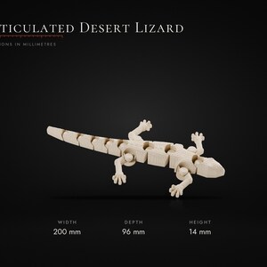 May include: An articulated desert lizard figurine in a light beige color. The text reads: Articulated Desert Lizard, Dimensions in millimetres, Width 200 mm, Depth 96 mm, Height 14 mm. The lizard has a segmented body and four detailed feet.
