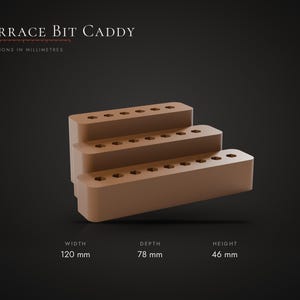 May include: A brown Terrace Bit Caddy with three tiered levels, each featuring rows of hexagonal holes for storage. The caddy measures 120 mm in width, 78 mm in depth, and 46 mm in height, as indicated by the text on the image.