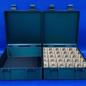May include: A dark green carrying case with two compartments. One compartment has a foam insert with 24 round holes. The other compartment is empty.