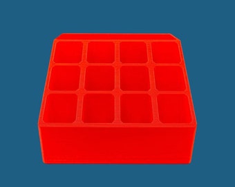 May include: A bright red plastic organizer with 12 compartments. The organizer is perfect for storing small items like jewelry, craft supplies, or office supplies.
