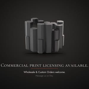 Puede incluir: Un grupo de columnas hexagonales verticales de color gris oscuro y alturas variables. Debajo del objeto, el texto dice: COMMERCIAL PRINT LICENSING AVAILABLE. Wholesale & Custom Orders welcome. Message us on Etsy.