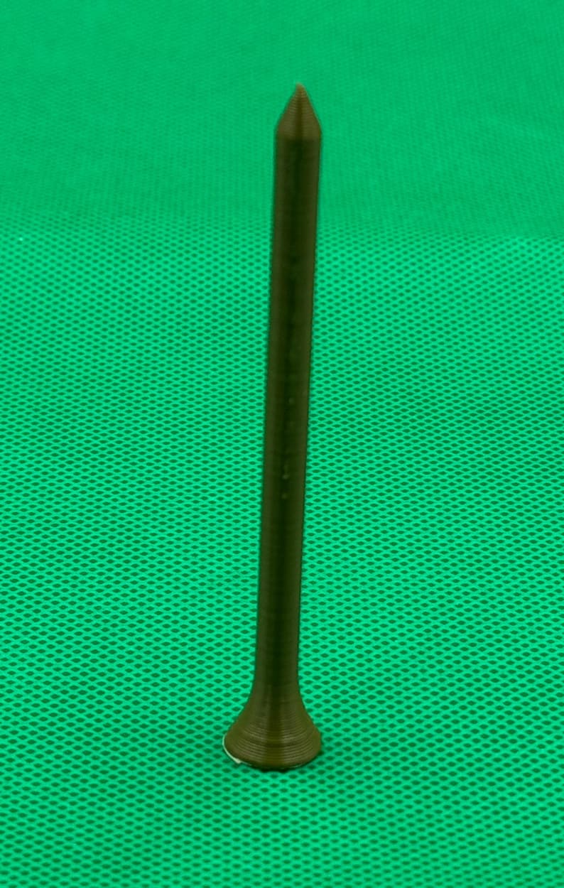 May include: A brown golf tee with a pointed tip and a flared base.