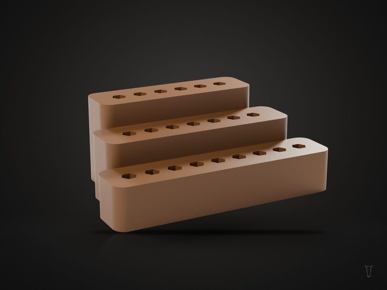 May include: A tiered light brown display stand featuring three levels, each with a row of six hexagonal holes along the top surface. The structure has rounded edges and a smooth, matte finish, arranged in a stepped formation for organized storage.