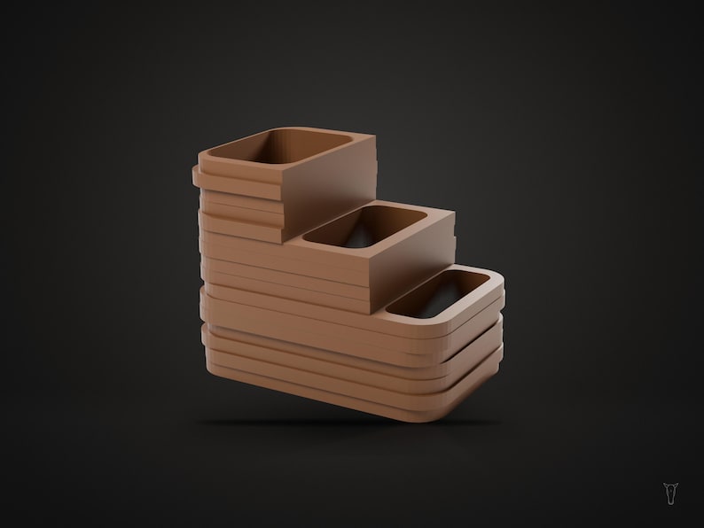 May include: A matte brown tiered organizer featuring three rectangular compartments arranged in a stepped formation. The structure has rounded corners and a smooth, solid finish, designed with a cascading layout that creates three distinct levels.
