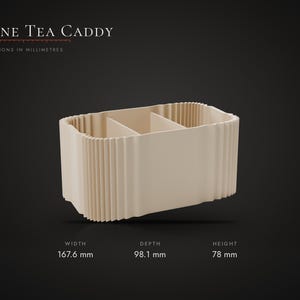 May include: A beige Dune Tea Caddy with a ribbed exterior and internal dividers. The caddy measures 167.6 mm in width, 98.1 mm in depth, and 78 mm in height. The text Dune Tea Caddy is displayed above the object with dimension details.