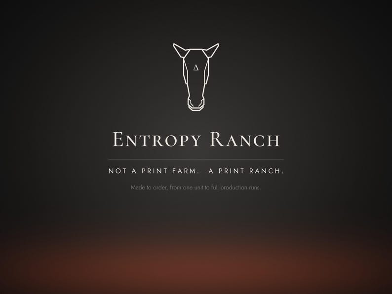 May include: A dark gray graphic featuring a white line-art horse head icon with a small triangle on the forehead. Text reads: ENTROPY RANCH, NOT A PRINT FARM. A PRINT RANCH., and Made to order, from one unit to full production runs.