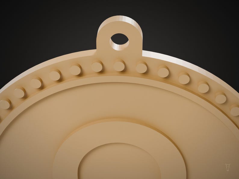 May include: A light tan circular pendant featuring a top loop for hanging. The outer edge is decorated with a series of small, evenly spaced raised circular studs. The center of the pendant has a smooth, recessed circular design.