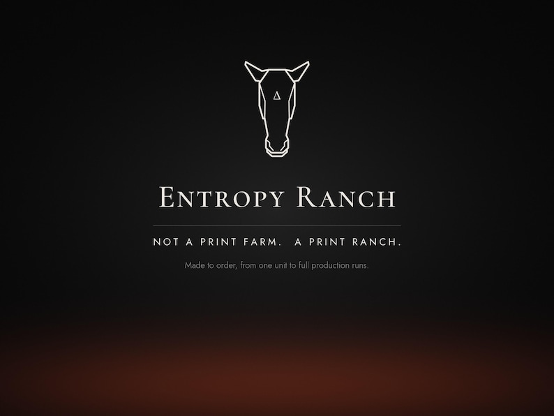 May include: A black graphic design featuring a white line-art horse head icon with a small triangle on the forehead. The text reads: ENTROPY RANCH, NOT A PRINT FARM. A PRINT RANCH. Made to order, from one unit to full production runs.