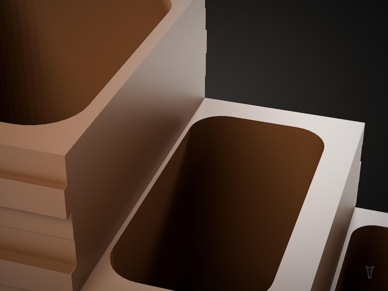 May include: A set of three tiered, rectangular, light beige containers with rounded interior corners. The containers are arranged in a stepped formation, each featuring a deep, hollowed-out center with a smooth, matte finish.