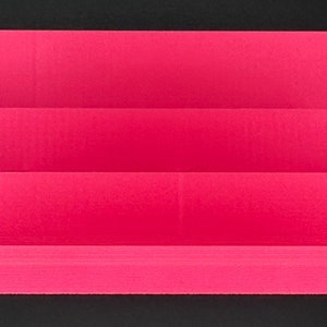 May include: A bright pink tiered display stand featuring three distinct levels of varying heights. The structure is composed of horizontal rectangular platforms arranged in a stepped formation, providing a clear surface for organizing items.