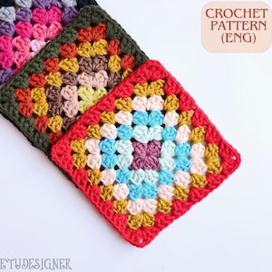 May include: Three colorful crocheted granny squares in shades of red, blue, yellow, pink, and green. The squares are arranged diagonally, showcasing the intricate stitch patterns. The text "CROCHET PATTERN (ENG)" is visible in the upper right corner.