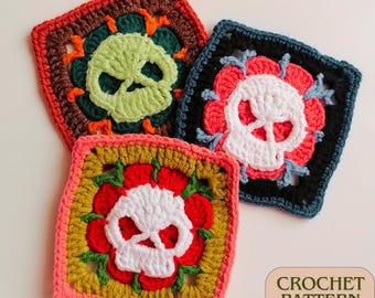 May include: Three crocheted square motifs featuring a skull design. The skulls are white with black eyes and are surrounded by colourful flowers. The squares are in shades of green, orange, red, pink, and blue.