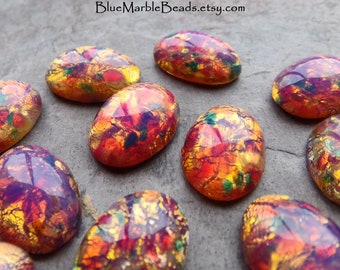 Kaboszony z antycznego szkła Fire Opal, z płaskim tyłem wypukłym (16 mm x 12 mm)